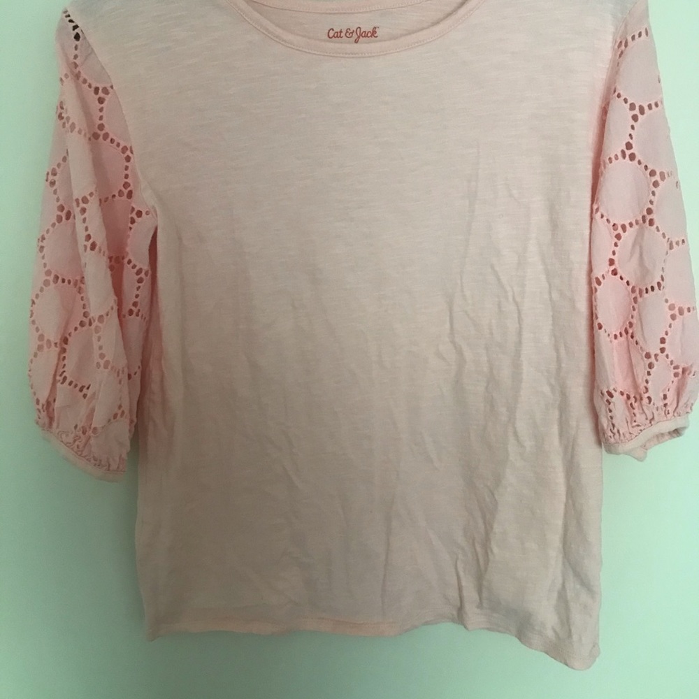 Pink arm see through blouse.